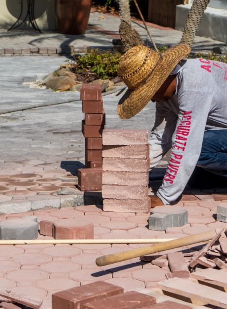 Accurate Pavers Employee Installing Project