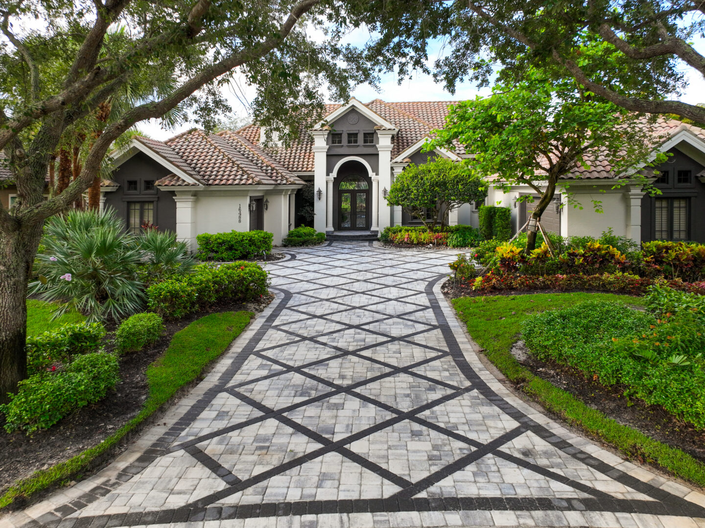 a paver walkway leading to a house